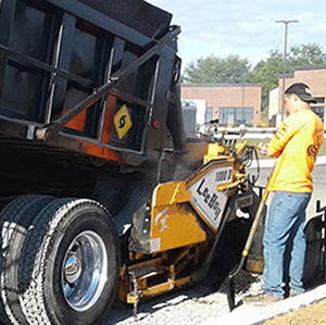 Johnny Storm Paving & Seal Coat laying asphalt